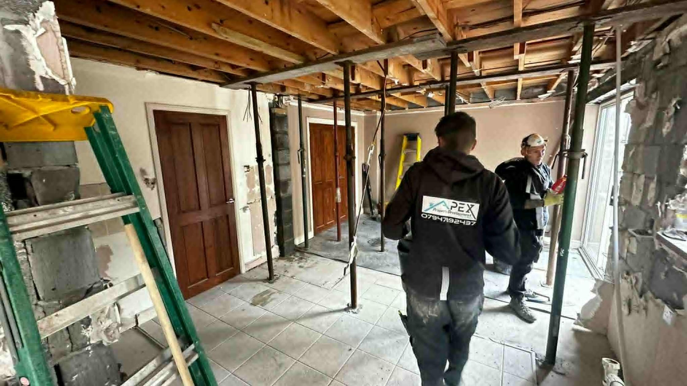 Builders in Port Talbot completing house renovation.
