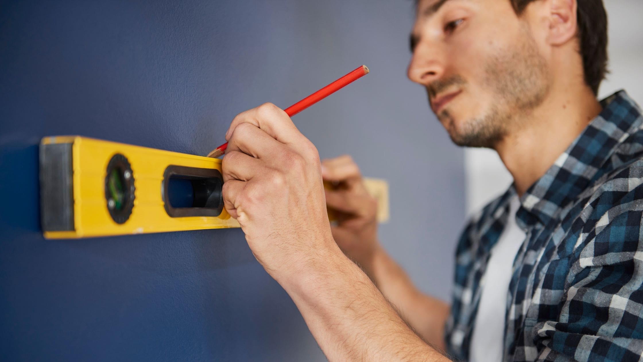 Level Measuring a spirit level on a wall