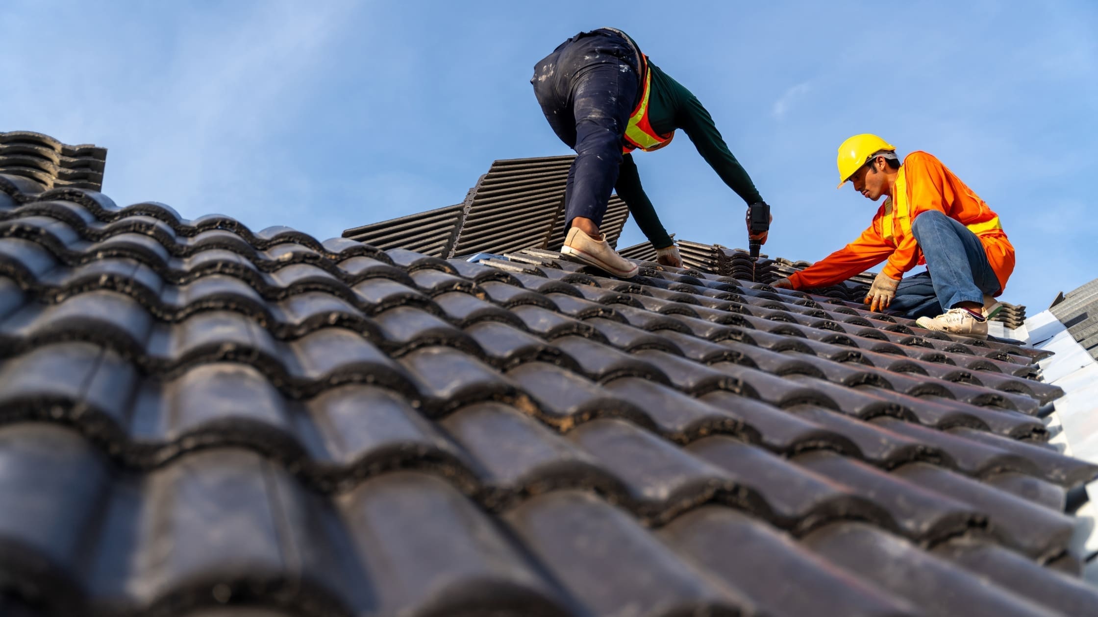 builders repairing a roof
