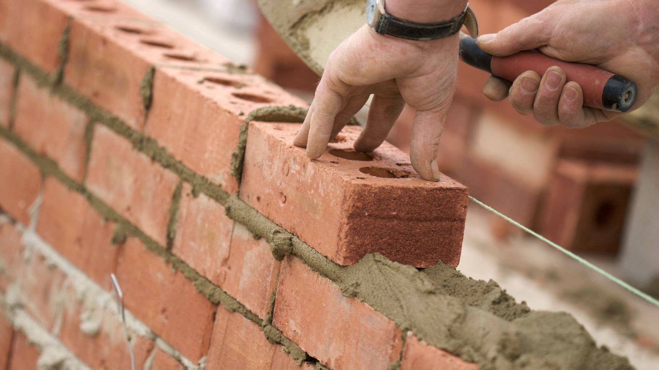 What Should I Consider Before Building a Wall at My Property (Blog Banner) building a wall